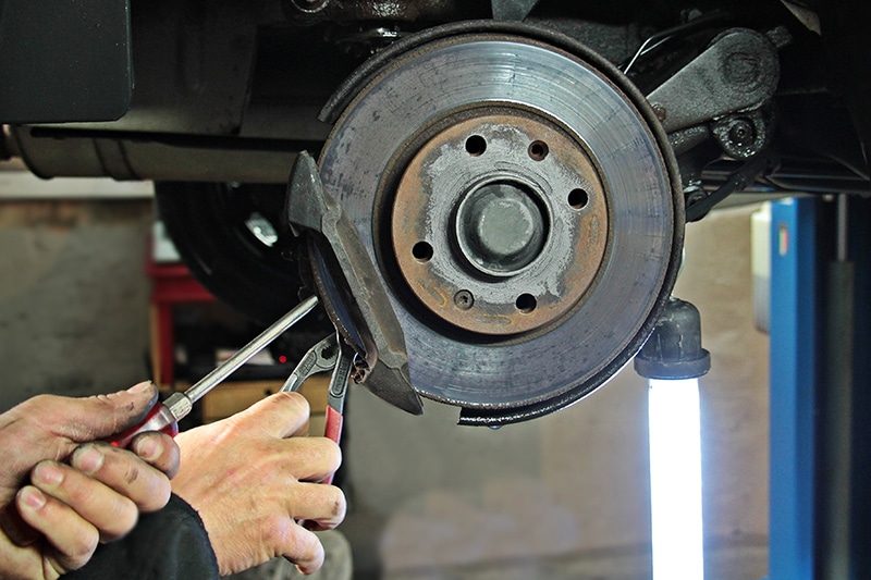 Brake pads and rotor exposed with the wheel removed
