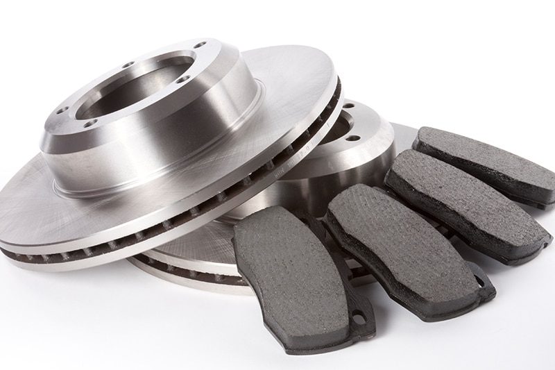 Brake pads and rotor exposed with the wheel removed