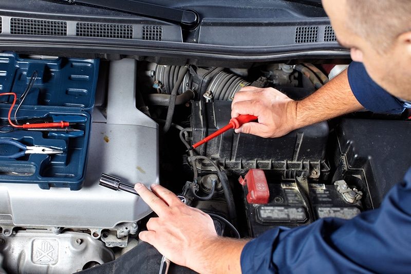 A car battery and charging system being tested