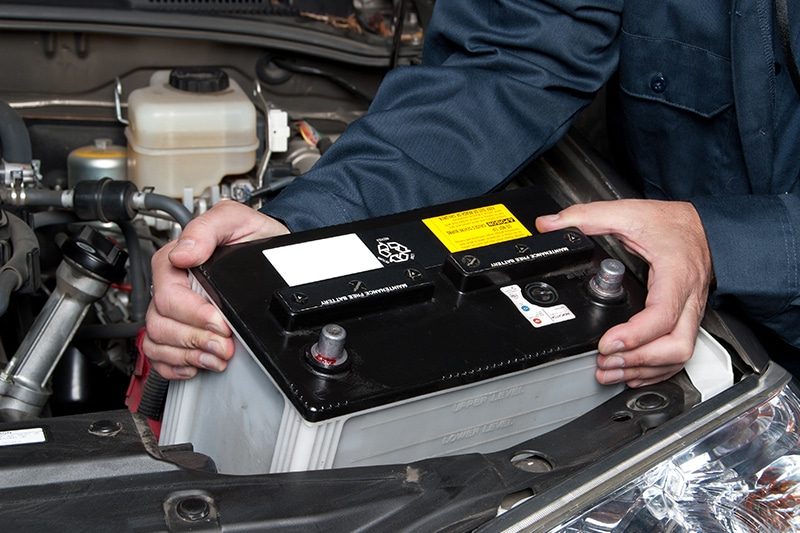 A car battery and charging system being tested