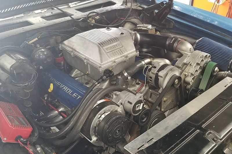 An engine being worked on with the bay open