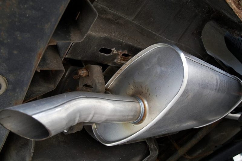 The underside of a vehicle showing the exhaust system