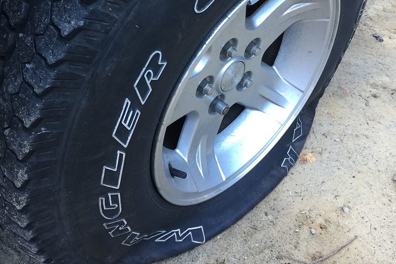 A tire being mounted and balanced in the shop