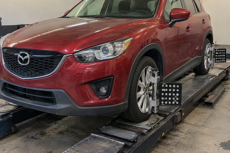 A Mazda in the service bay at Dakota Ridge Auto