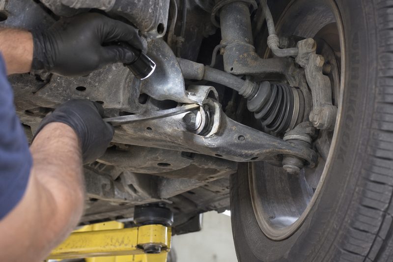 Suspension inspection on a lift at Dakota Ridge Auto